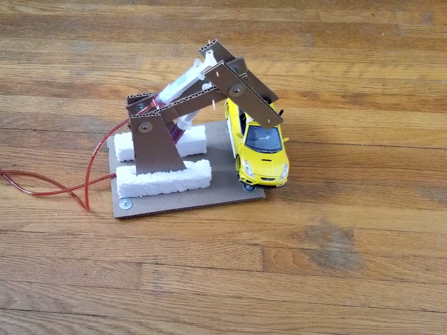 Picture of the hoist lifting a model car